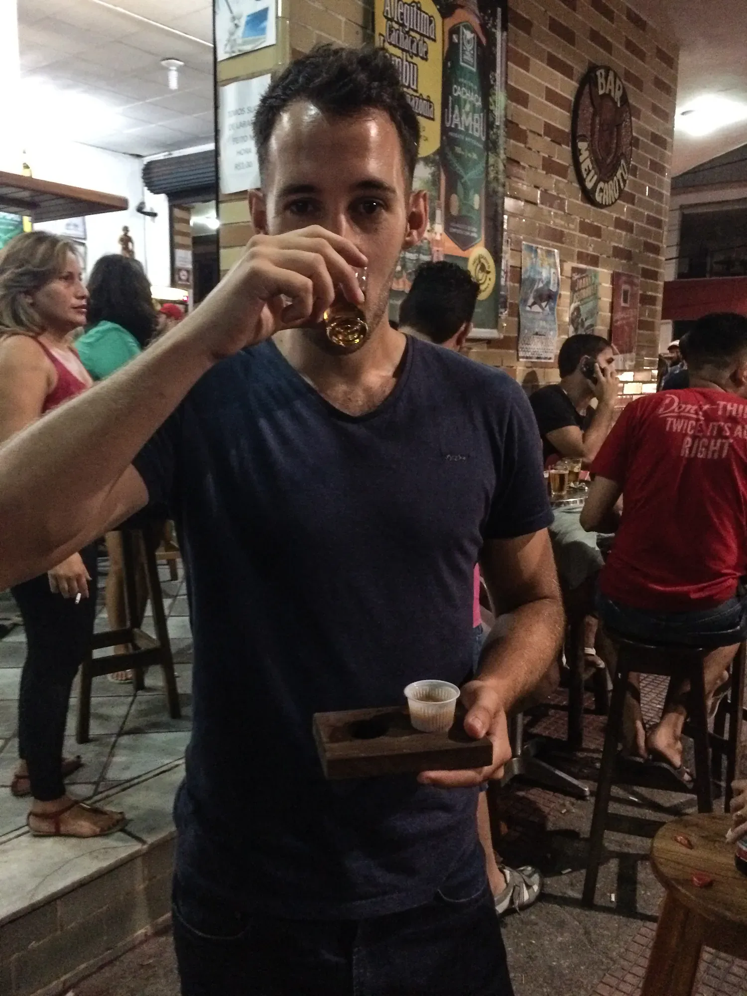 Having a shot of Cachaça and soup