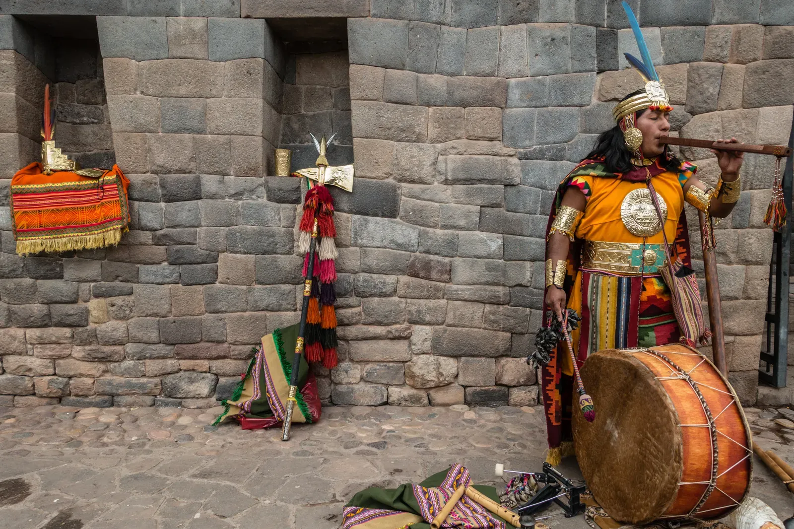 A man in traditional Inca clothing