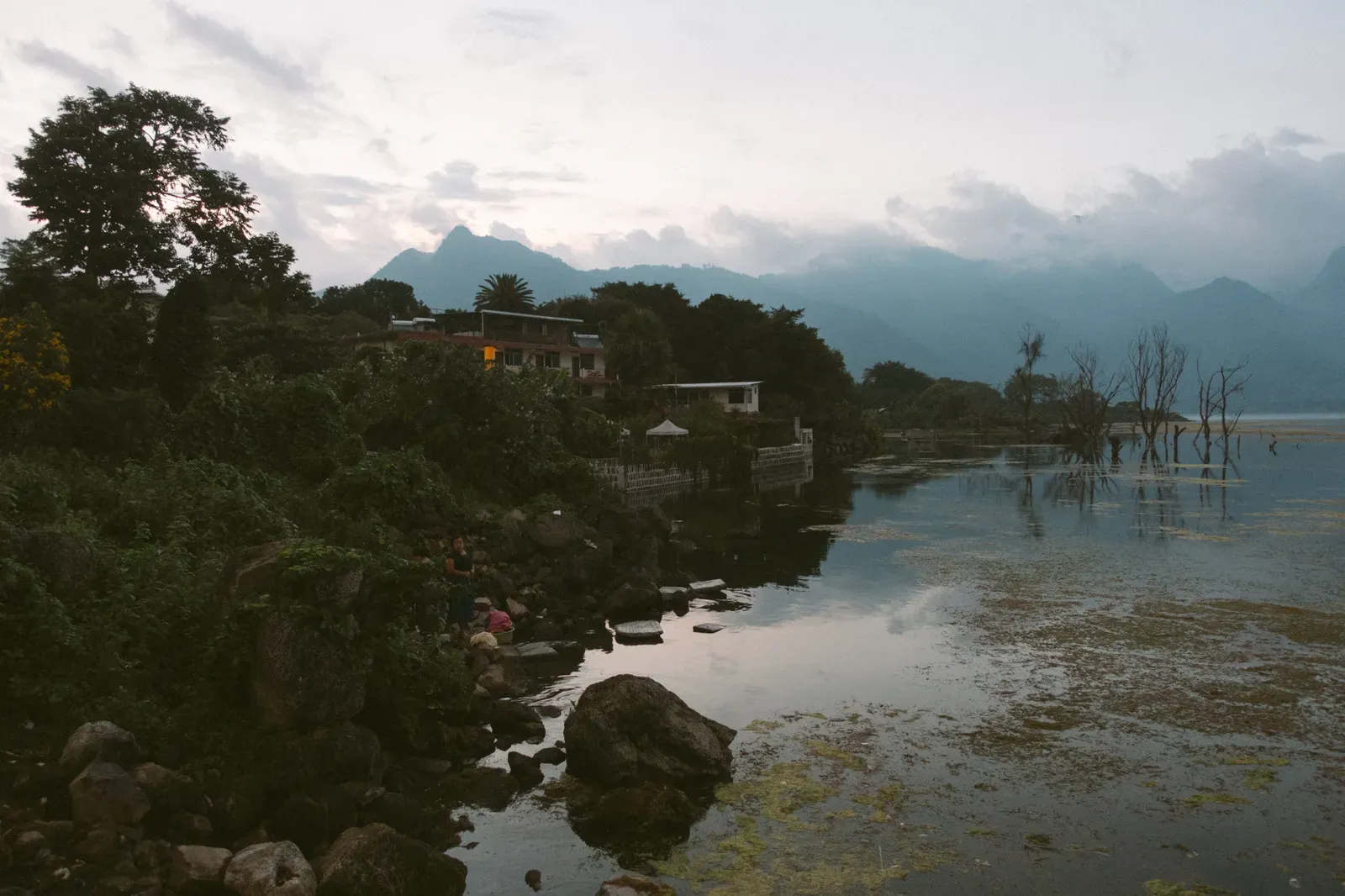 Local women washing their clothes in the lake