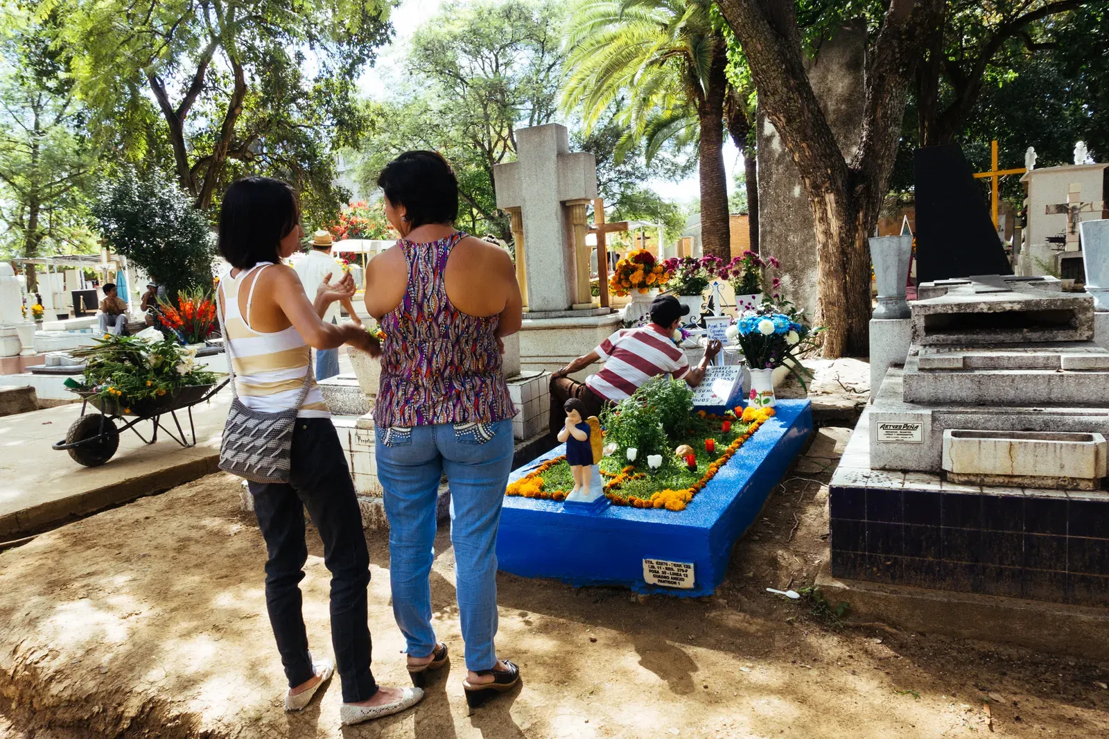 A family preparing the grave of a lost loved one